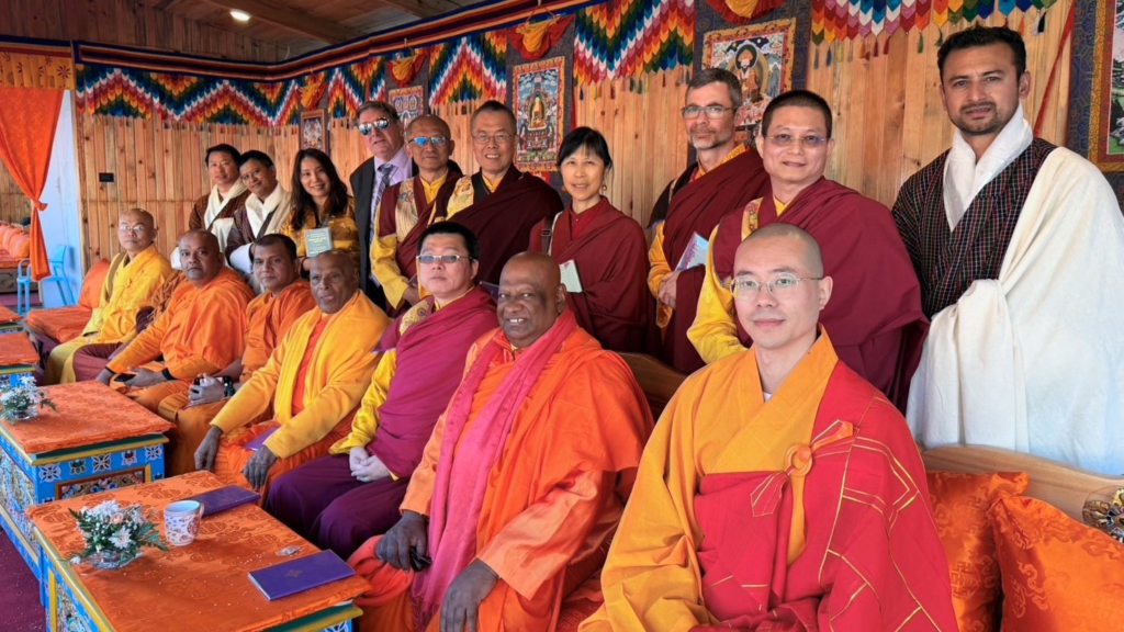 Group photo of the Buddhist travel group after the special audience with H.H. the Je Khenpo at the Thimphu stadium following the Kalachakra initiation.