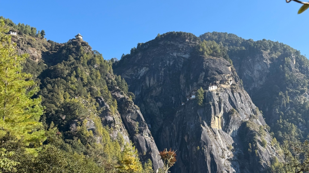 View of Taktsang Monastery on the cliff face, taken from the cafeteria viewpoint halfway up the trail.